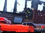 Při požáru autoservisu se škodou dva miliony byli zraněni dva hasiči